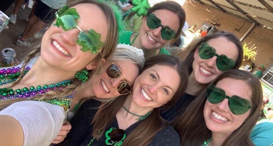 six pediatric residents wearing St. Patrick's Day accessories